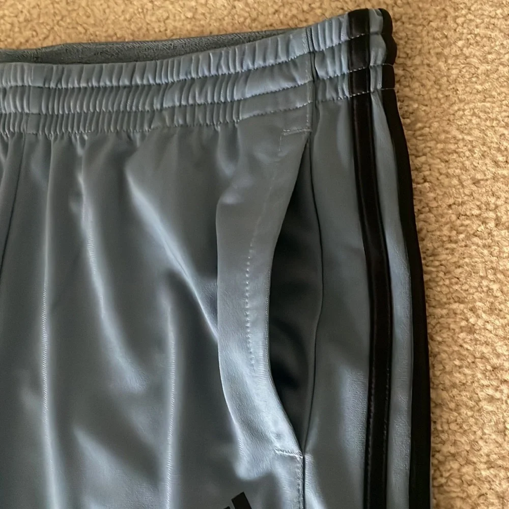 Adidas Men’s Joggers. Blue/grey color with black stripes.